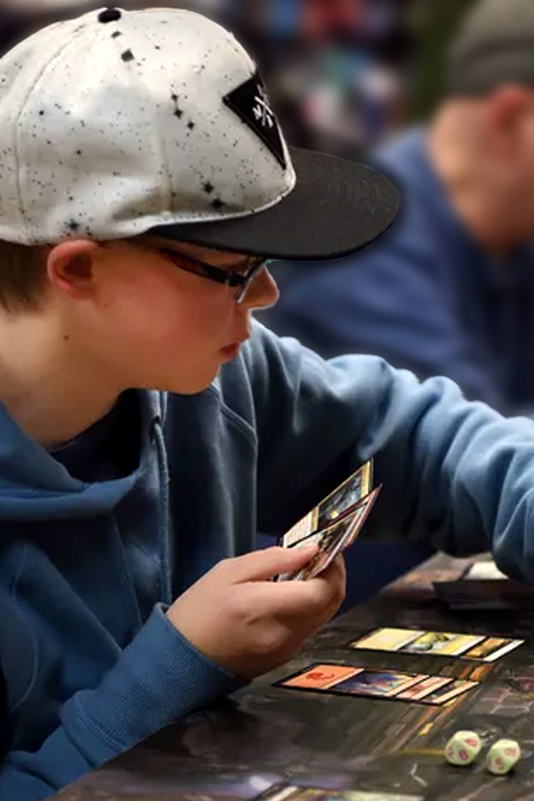 Youth playing collectible card games.